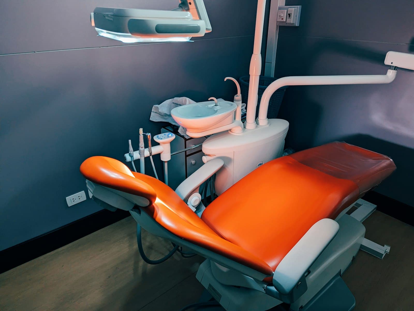 A dental surgery chair under the examination light