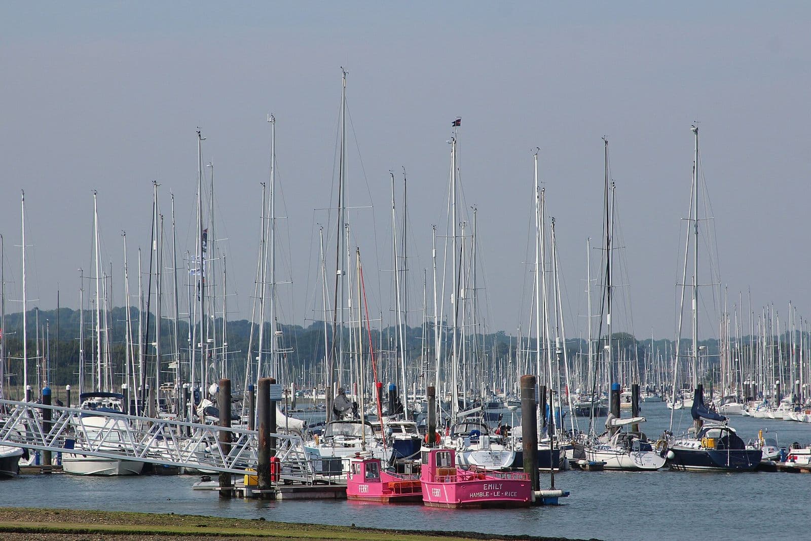 Yachts on their berths at Hamble Marina, with the Hamble ferry in the foreground